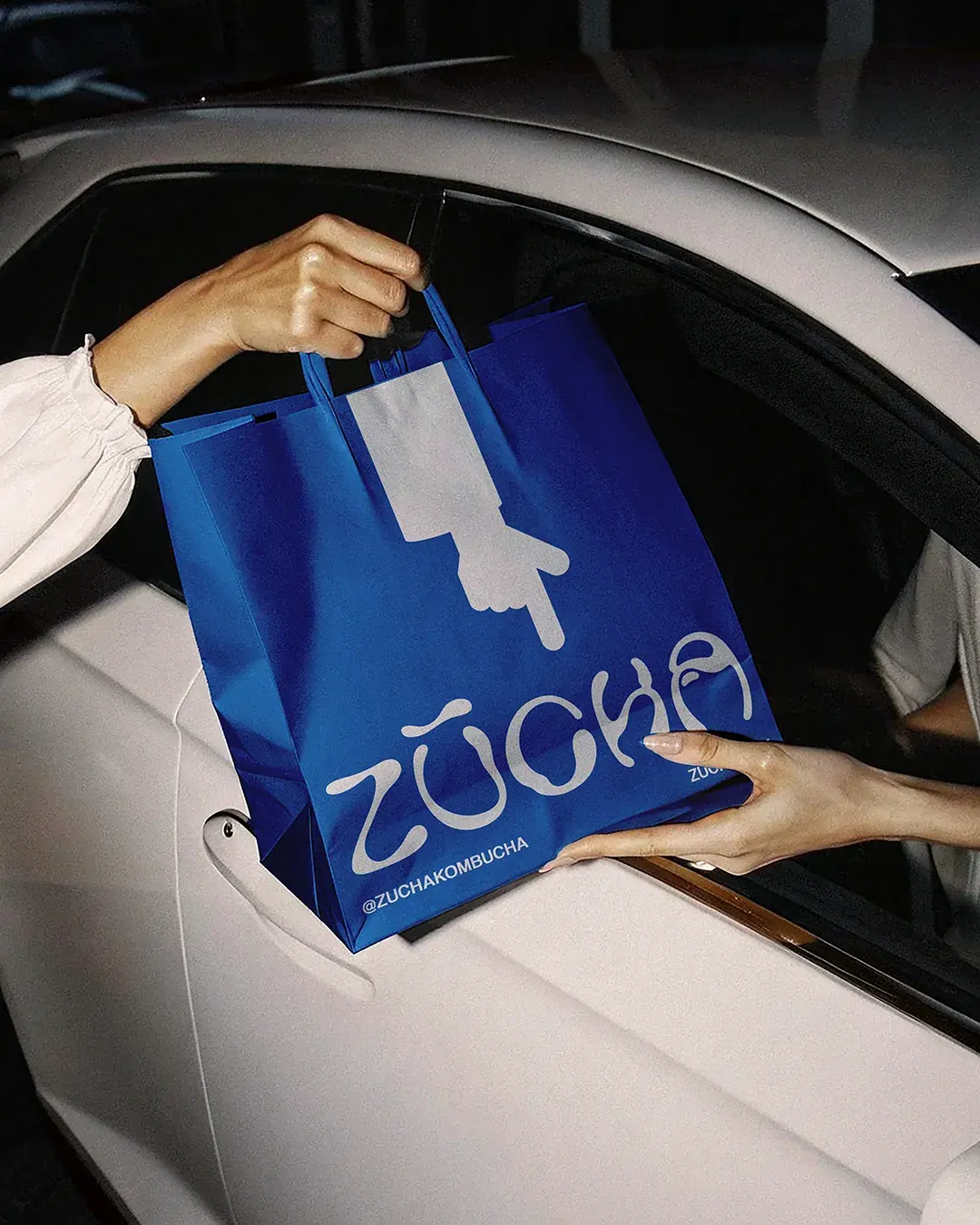 ZŪCHA Takeaway Bag Passed Into Car