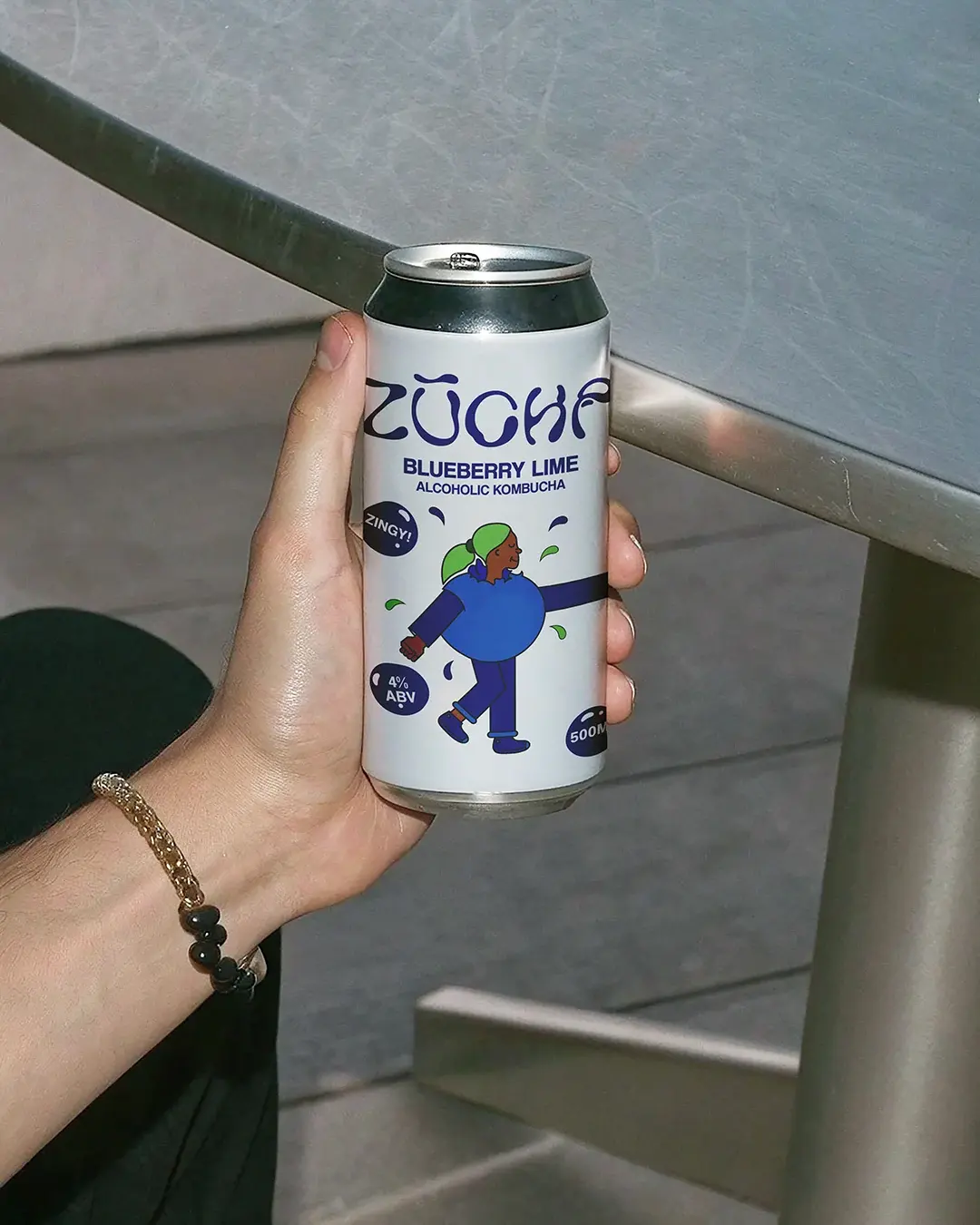 ZŪCHA Blueberry Lime Can Held In Hand