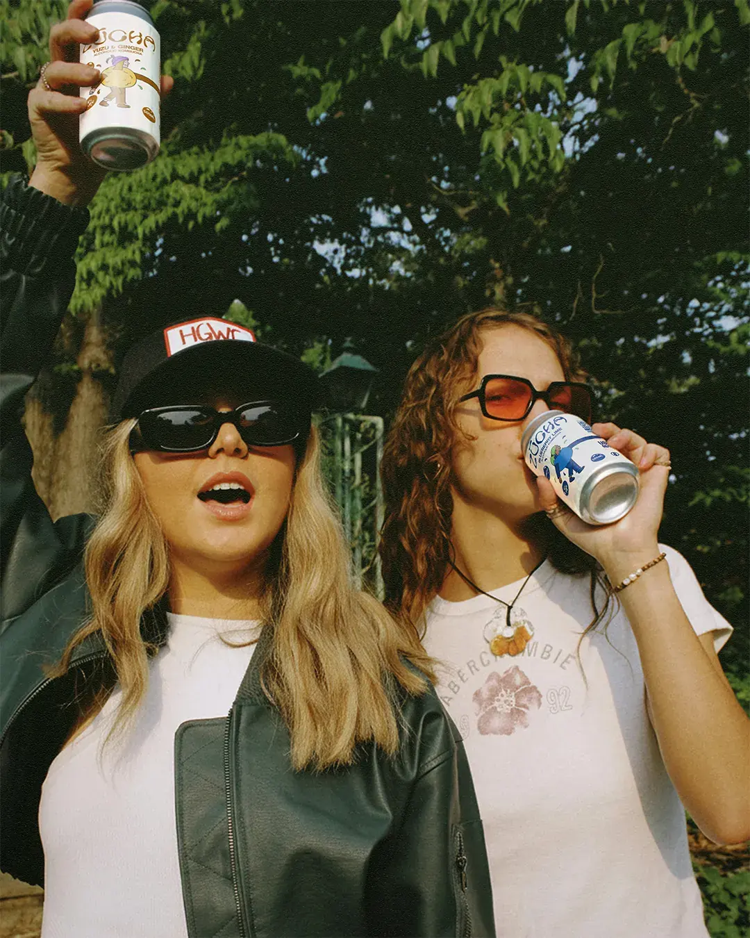 Two people Enjoying ZŪCHA Cans at Gathering